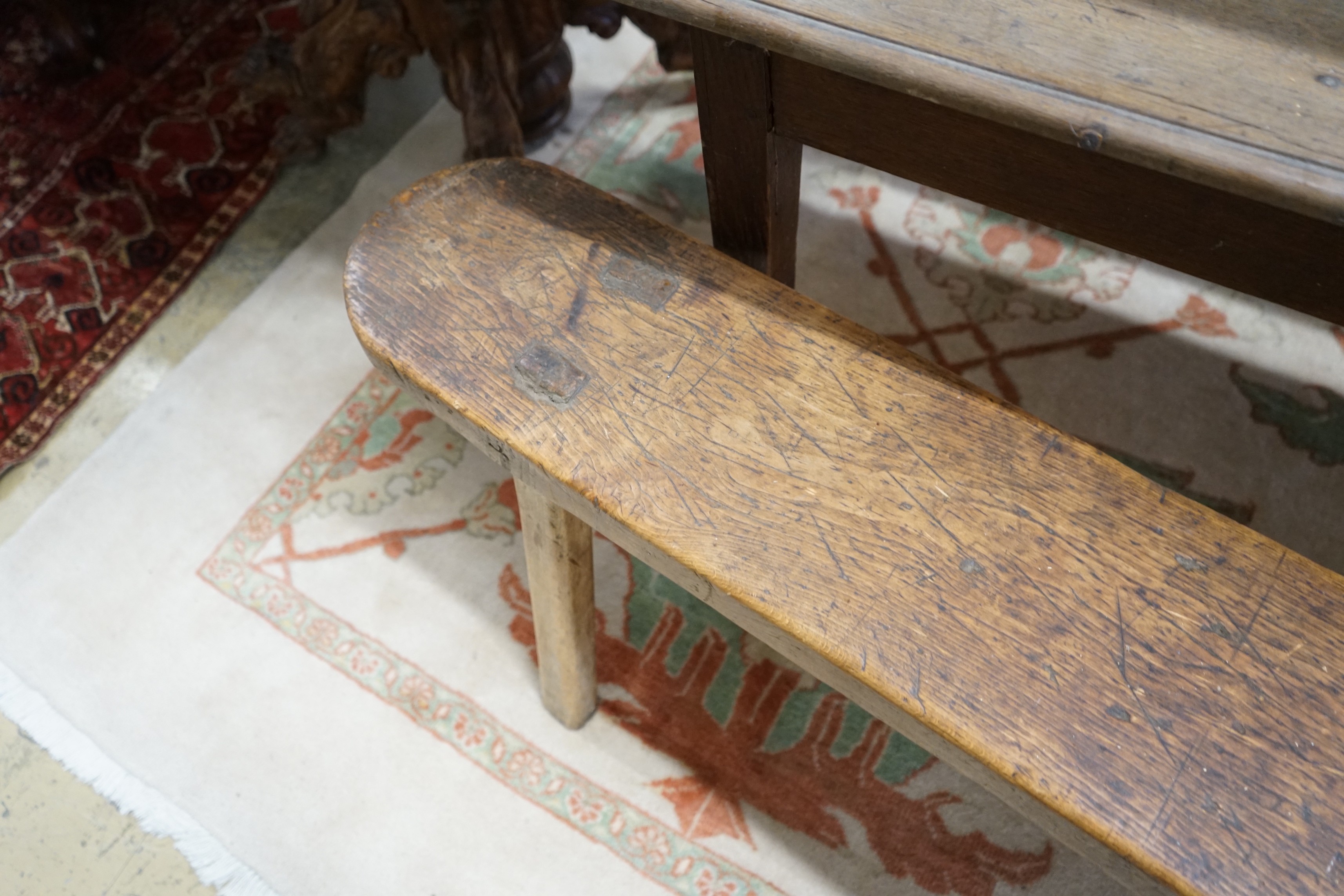 A pair of 19th century provincial elm and beech bench seats, length 199cm, depth 23cm, height 48cm